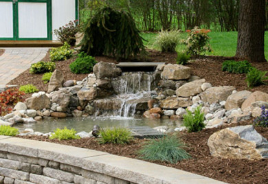 Stone waterfall garden landscaping feature.